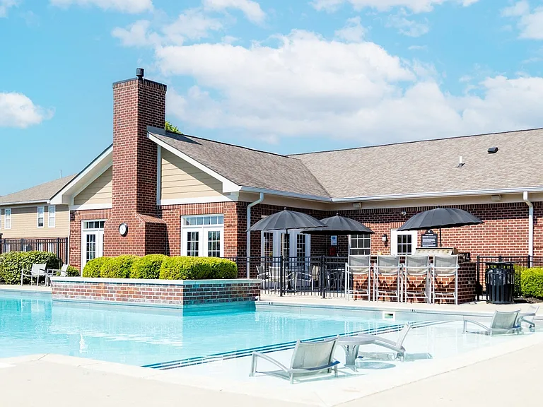 Resort-Style Swimming Pool with Seating and a Grilling Station at Westhaven Luxury Apartments
