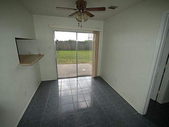 BREAKFAST ROOM OVER LOOKS THE BACK YARD