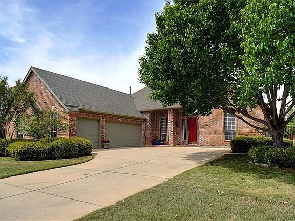Ovesized three car garage with built in storage shevling.