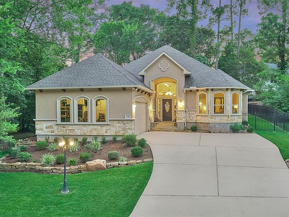 The charming architecture and three lamp light post add such detail to the curb appeal of this home.