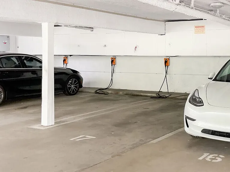 Large covered parking lot with EV Chargers.