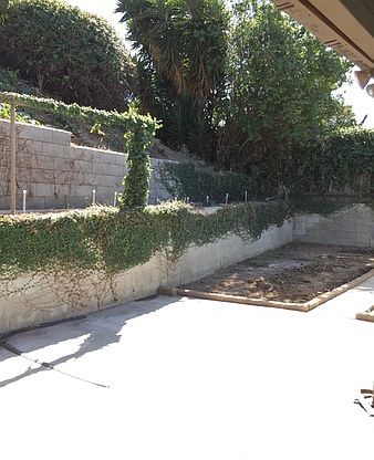 Terraced back yard with large patio