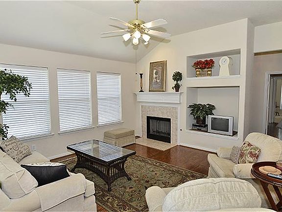 Hardwood flooring continues into the family room