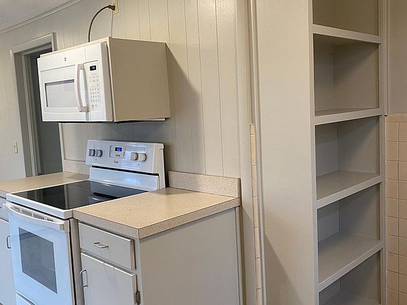 Kitchen storage and oven with microwave/vent.