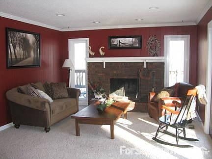 Living Room
						:
						Features a fireplace, french doors, and recessed lighting.