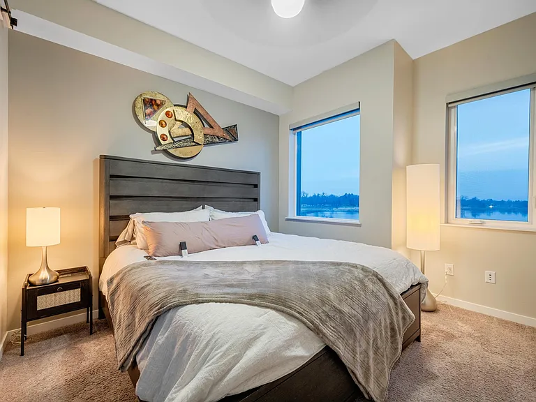 With bedroom views like these, you may not want to get out of bed! Luckily with remote control blinds, smart TV, fan, and lights, you won't have to! This King sized Sleep Number bed is the best for picky sleepers to find their perfect comfort level!