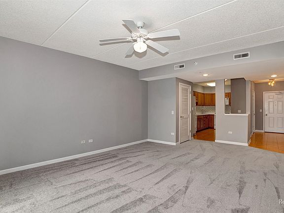 Living Room views to Kitchen and hallway