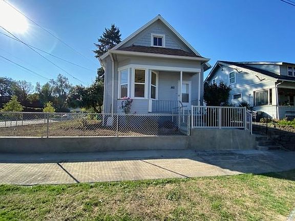 This is the front of the house. The yard has been replanted with grass and rose bushes along the house. The property is completely fenced with 2 gates