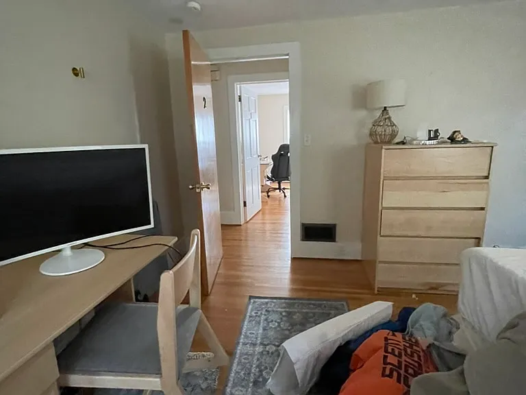 Bedroom 2: Our NEW furniture; photo shows student belongings.