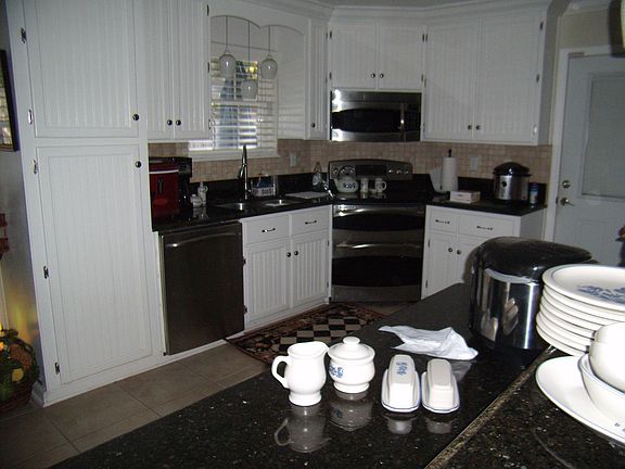 Site built custom kitchen cabinets, granite countertops, NEW GE appliances
