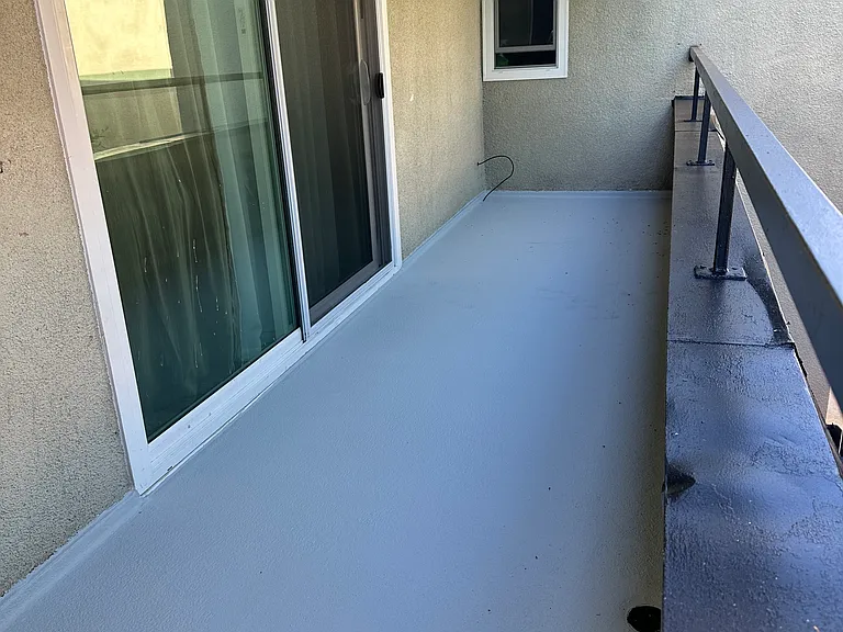 Photo of Newly Renovated Patio with access from Living Room. Trees to the right provide privacy from neighbors and black out and sheer curtains on sliding patio doors allow for interior light control and additional privacy as needed