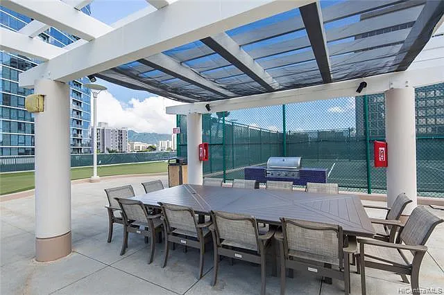 One (of the twelve) outdoor BBQ grill / dinning areas with canopies