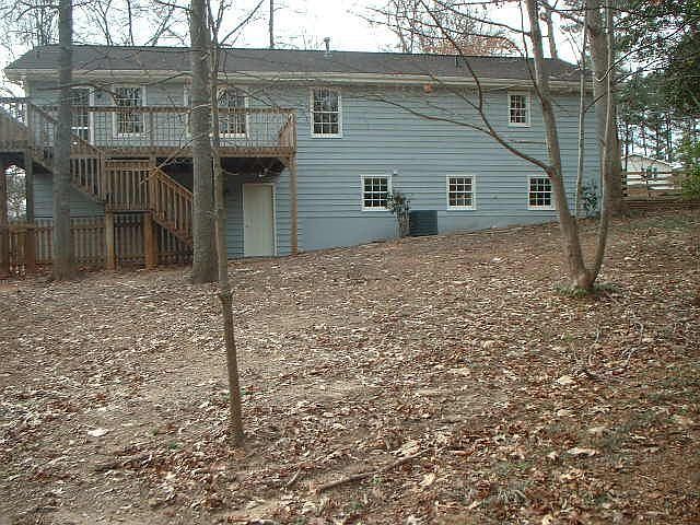 large wooded, fenced yard.  Deck for cookouts.