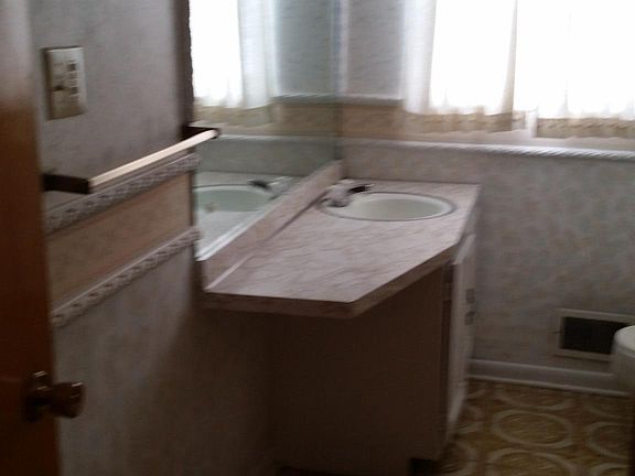 Second floor bathroom has a bathtub