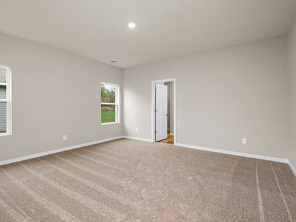 The master bedroom is spacious with a window