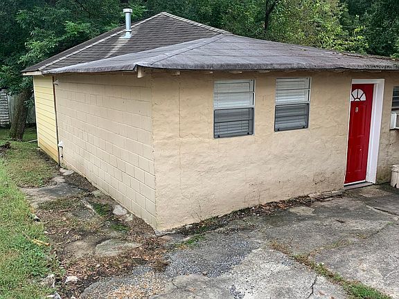 Exterior of unit with parking spot at front door