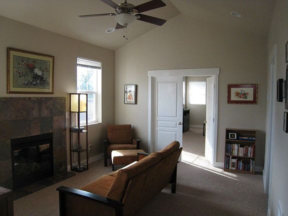 Family room or game room with second fireplace.