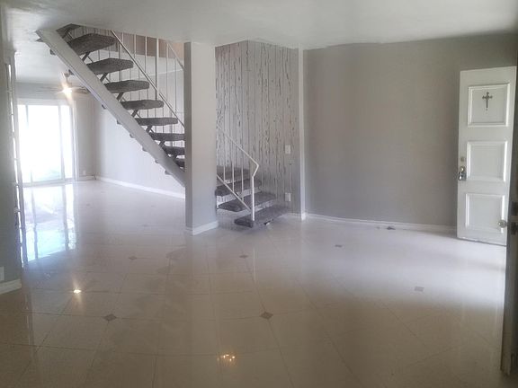 Spacious Living room open to dining room with lots of natura