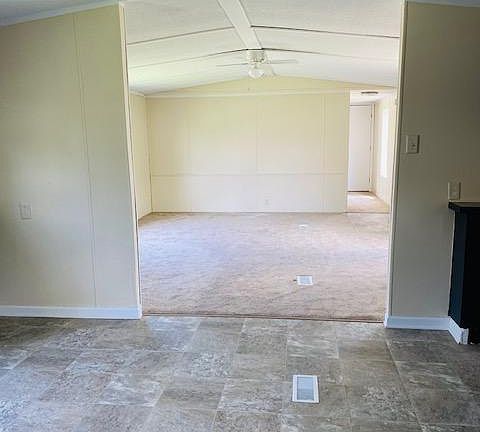 $34,500.00 for home then $305 per month - Kitchen & Livingroom view