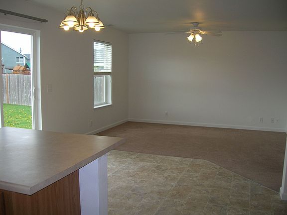 view from kitchen through dining room to the family room