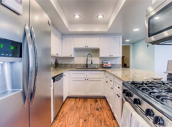 Updated kitchen with granite counters, new cabinets and stainless steel appliances