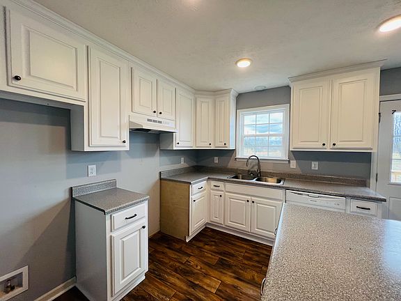 Kitchen with island and plenty of cabinetry