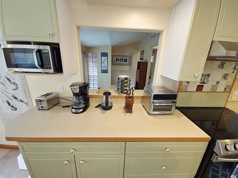 New toaster, microwave, air fryer, coffee maker and instant (not shown). Full cookware and dining ware.