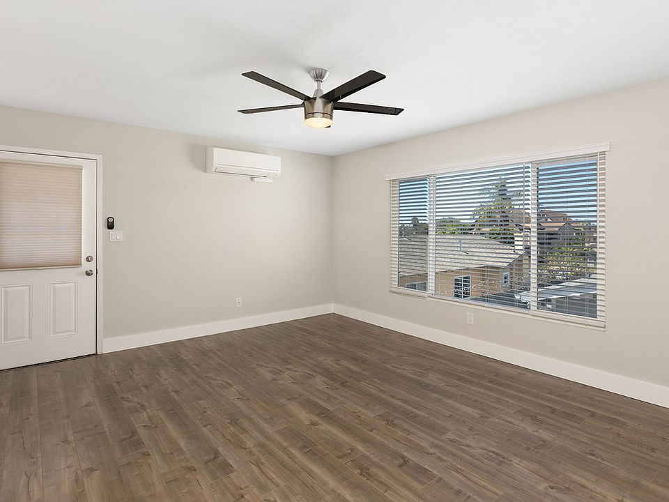 Living Room with new flooring. Picture is facing Front Door.