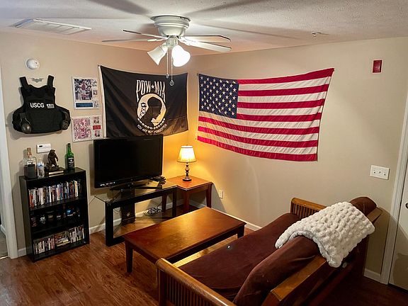 Living room. Futon, coffee table and 2 end tables come with unit