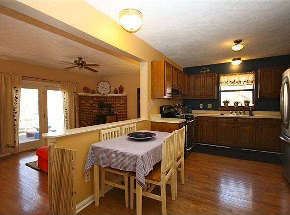 Kitchen overlooks family room.