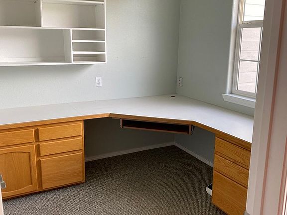 Unfurnished front office with built-in desk