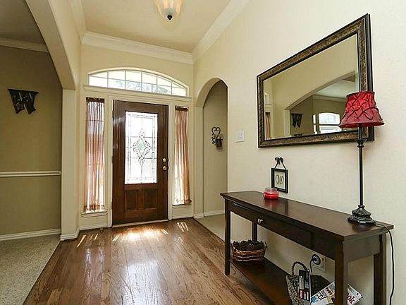 Inviting entry way with wood flooring.