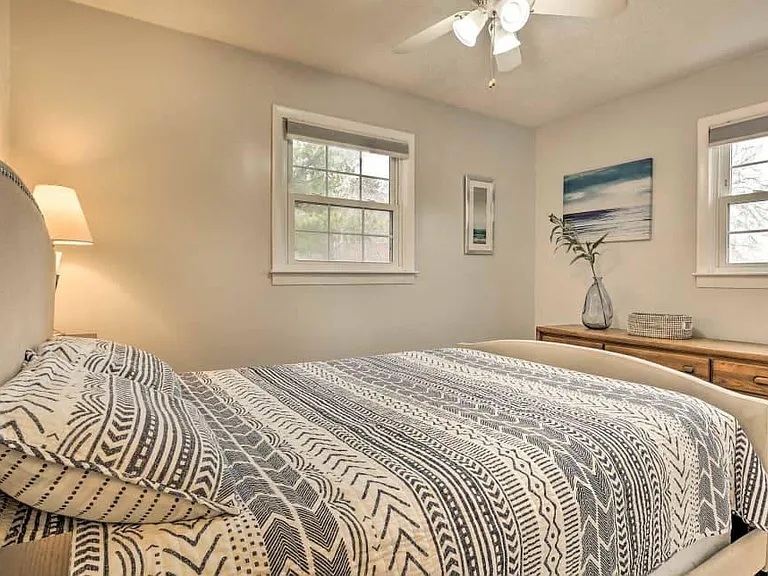 The "ocean room", queen size bed, chest of drawers.