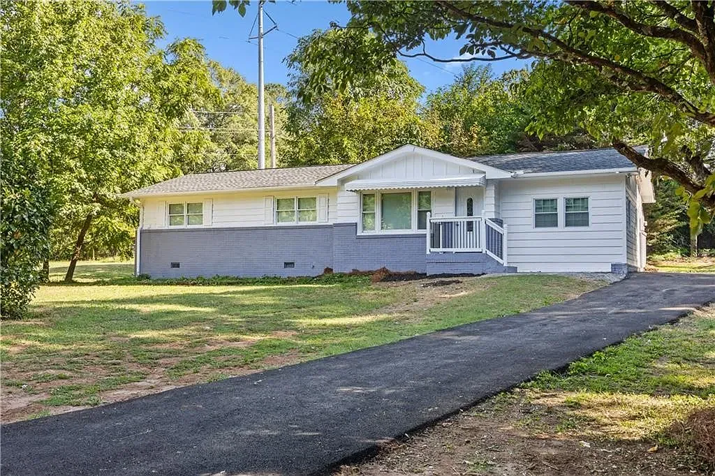 Front view of the house from the street of the and driveway. - Boyd Rd