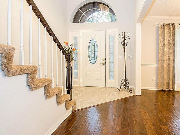 Welcome home! Beaming wood flooring thru out the downstairs of this remodeled house.