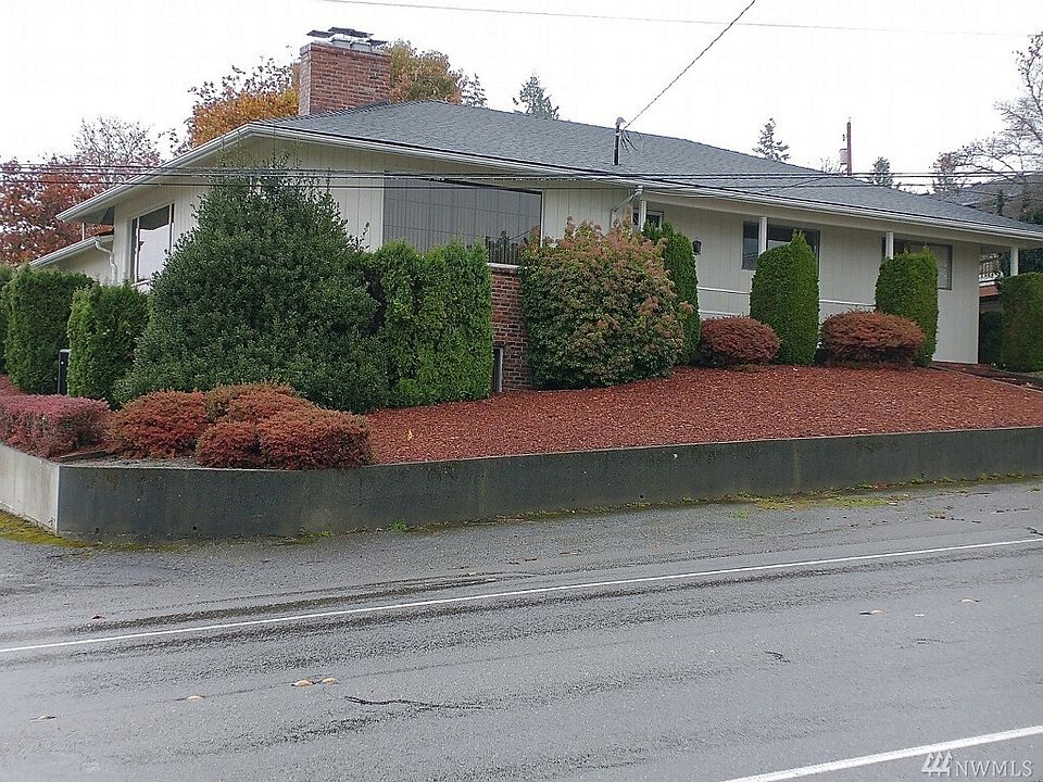Large home on a corner lot with great views of the Olympics.