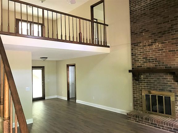 Living room and dining area with balcony and fireplace - Bedroom 3 upstairs right