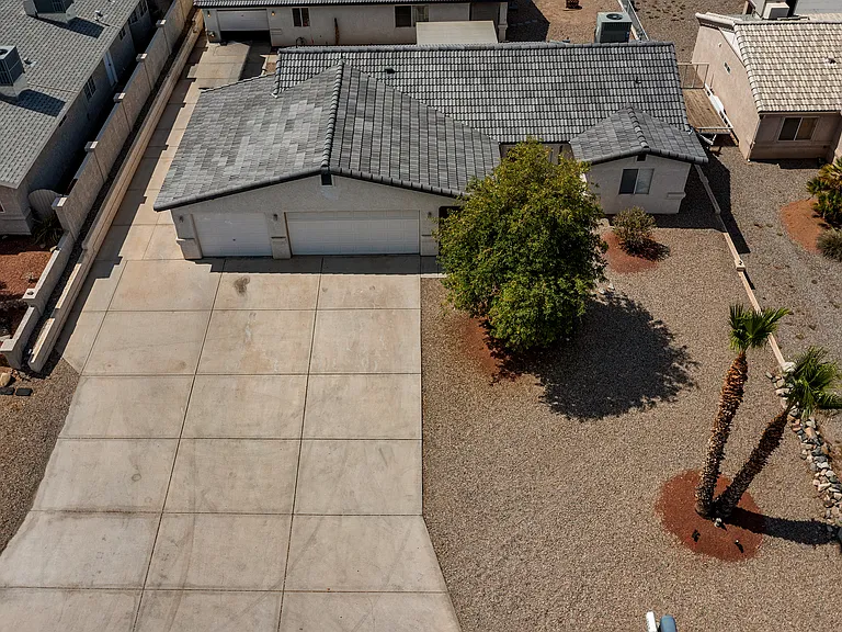 Aerial view. HVAC unit on roof over Bedroom 2. Front window to Bedroom 2.
