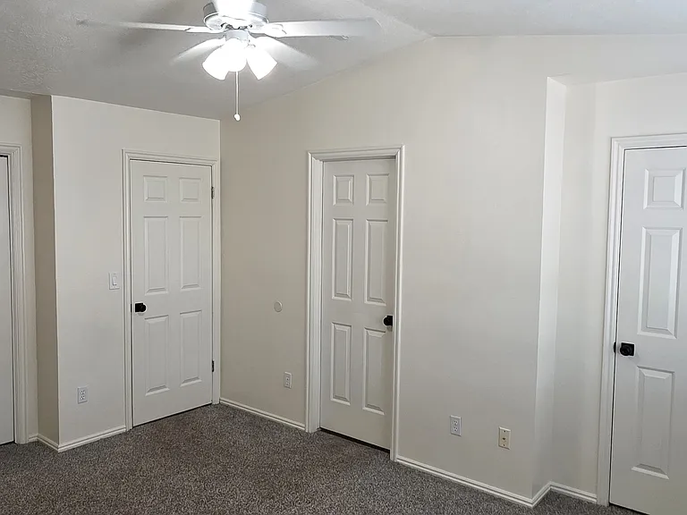PRIMARY BEDROOM WITH CATHEDRAL CEILING