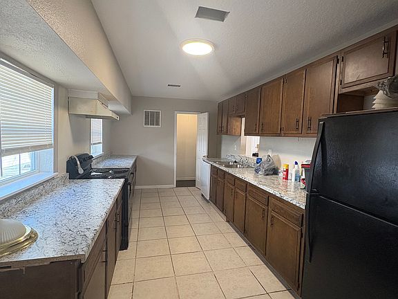 Long spacious kitchen with a ton of counter space