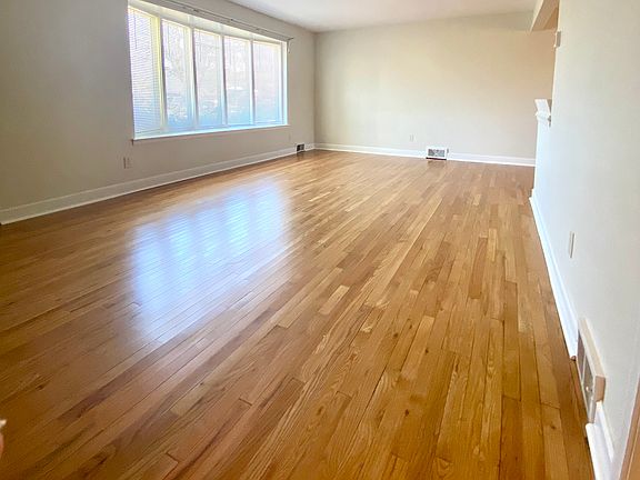 Living Room - Beautiful, refinished hardwood floors. Large bay window.
