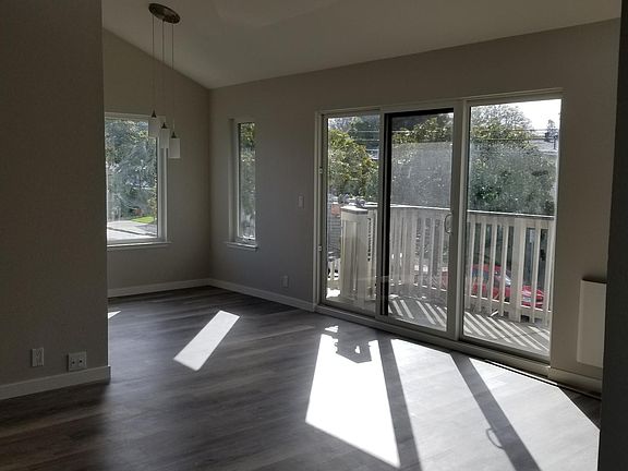 Living Room & Dining Area (View 1)