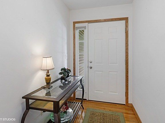 Welcoming foyer with side light and hardwood floors!