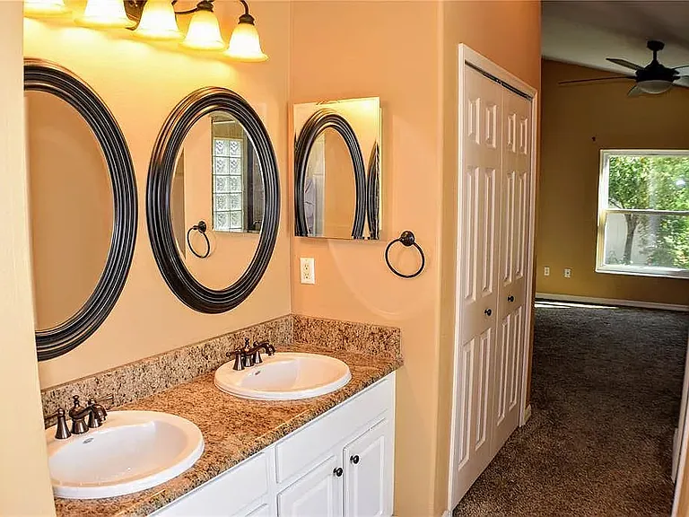 Master bathroom with granite countertop and double sinks