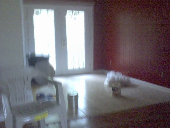 Dinning room has ceramic tile floors and French Doors