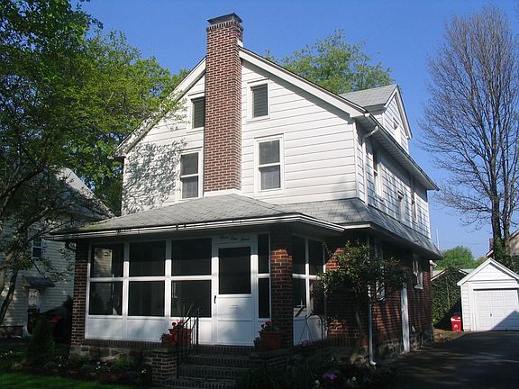 Exterior view with driveway and garage