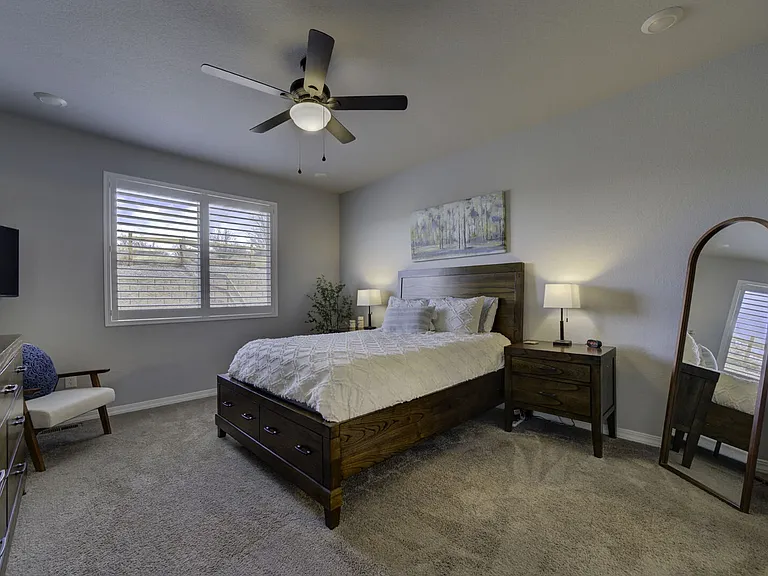 Master Bedroom
Primary suite offers a cozy queen bed, smart TV, full-length mirror, clothing storage, walk-in closet, and ensuite bathroom with dual vanity and walk-in shower
