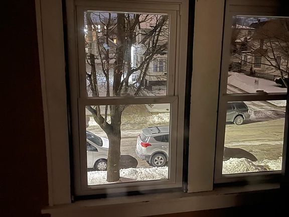 Front of apartment. View of 63rd Street below from that living room window. Parking on 63rd Street is always available in front of the duplex and plentiful year round.