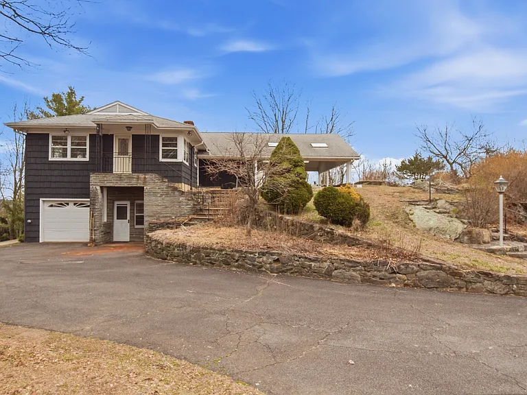 Tucked at the end of a quiet cul-de-sac, this exceptional estate offers rare privacy on more than 3 picturesque acres.