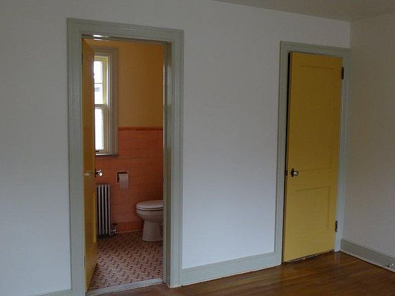 View into bathrm and closet door from Bdrm